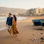 People strolling Agadir beach with city backdrop