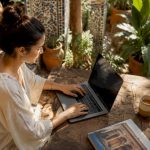 Woman booking Morocco flight at home